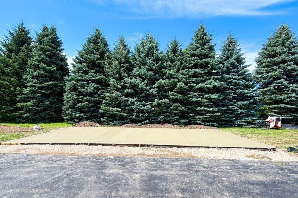 A completed concrete shed slab with expansion joints, ready for construction, a project by Concrete Landscape Solutions in Mukwonago, WI.
